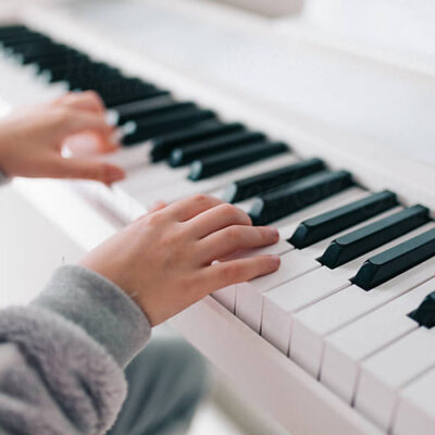 child playing piano | Rothewood Academy