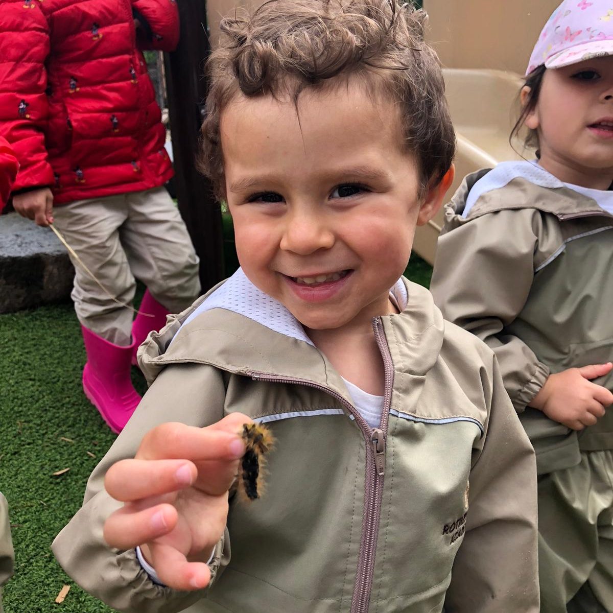 Girl looking at beetle | Experiential Learning Adventures